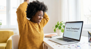 Happy Nigerian showing successful survey completion on Opinion Padi.