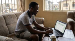 Nigerian tester filling out usability feedback form.